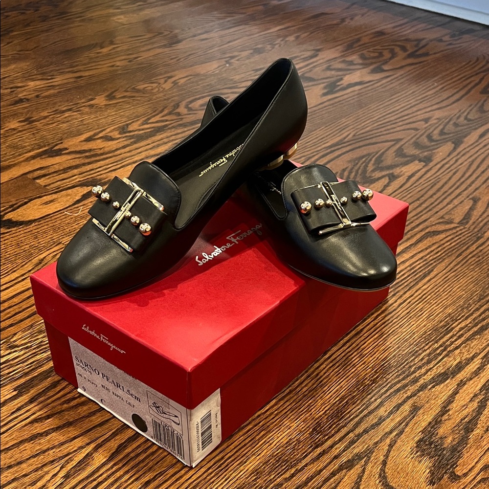Salvatore Ferragamo Black Flats with Gold Accents